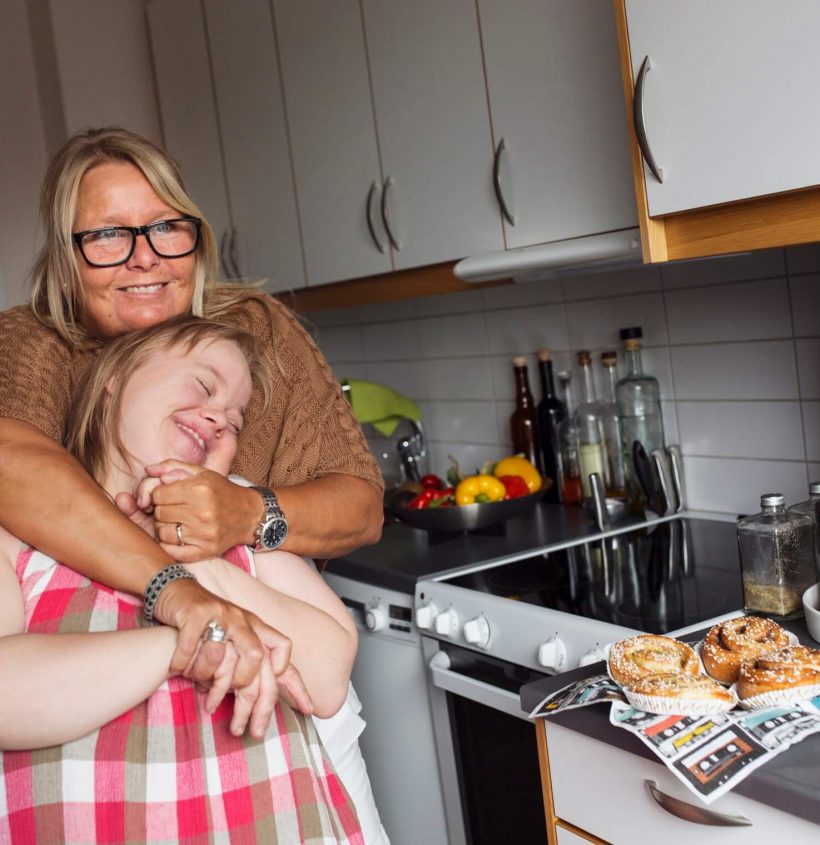 mother-hugging-daughter-with-down-syndrome-in-kitc-2022-02-02-03-56-46-utc (1)