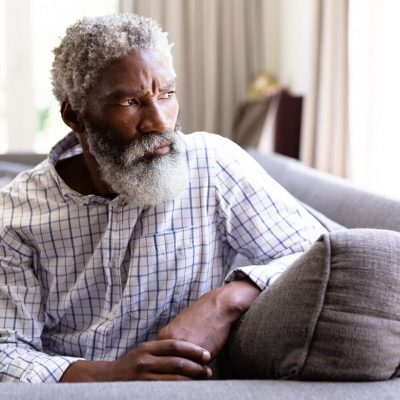 portrait-senior-african-american-man-home-sitting-couch-looking-away-from-camera-social-distancing-self-isolation-quarantine-lockdown-during-coronavirus-covid19-epidemic